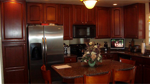 remodeled kitchen with cherry-wood cabinets